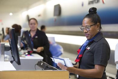 Ticketing Agent verifying customer information